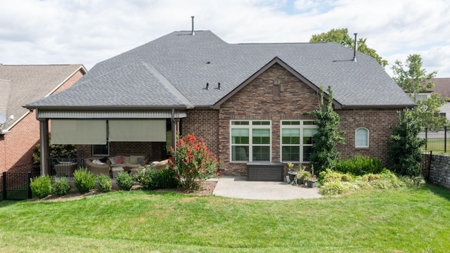 1303 Reynard Dr, Gallatin, TN 37066 - rear view of house featuring a patio area, roof with shingles, brick siding, and an outdoor living space