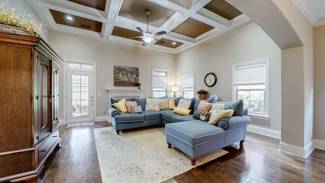 1303 Reynard Dr, Gallatin, TN 37066 - living area featuring healthy amount of natural light, ceiling fan, arched walkways, baseboards, and beam ceiling