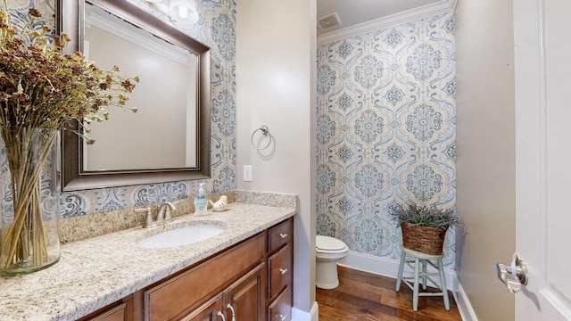 1303 Reynard Dr, Gallatin, TN 37066 - bathroom with ornamental molding, toilet, wood finished floors, vanity, and baseboards