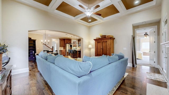 1303 Reynard Dr, Gallatin, TN 37066 - living room with arched walkways, a ceiling fan, a chandelier, baseboards, and coffered ceiling