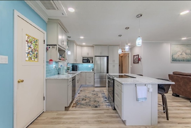 262 Purdy Rd, Selmer, TN 38375 - kitchen with black appliances, a center island, light wood-style floors, decorative backsplash, and recessed lighting