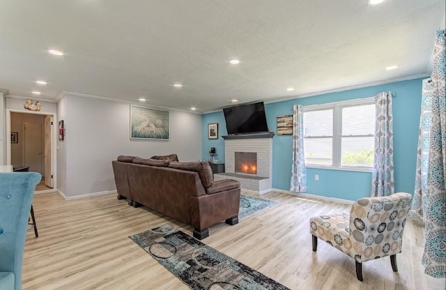 262 Purdy Rd, Selmer, TN 38375 - living area with baseboards, ornamental molding, light wood-style flooring, a brick fireplace, and recessed lighting