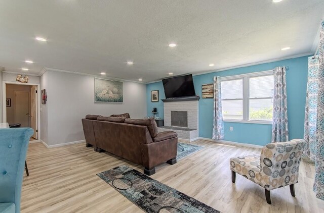 262 Purdy Rd, Selmer, TN 38375 - living area featuring baseboards, ornamental molding, light wood-style floors, a brick fireplace, and recessed lighting