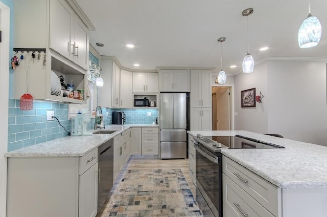 262 Purdy Rd, Selmer, TN 38375 - kitchen featuring stainless steel appliances, a sink, open shelves, a center island, and tasteful backsplash