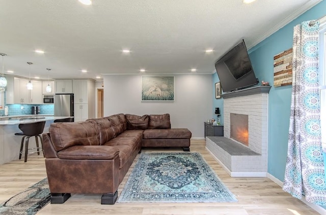 262 Purdy Rd, Selmer, TN 38375 - living area with light wood-type flooring, crown molding, a fireplace, recessed lighting, and baseboards