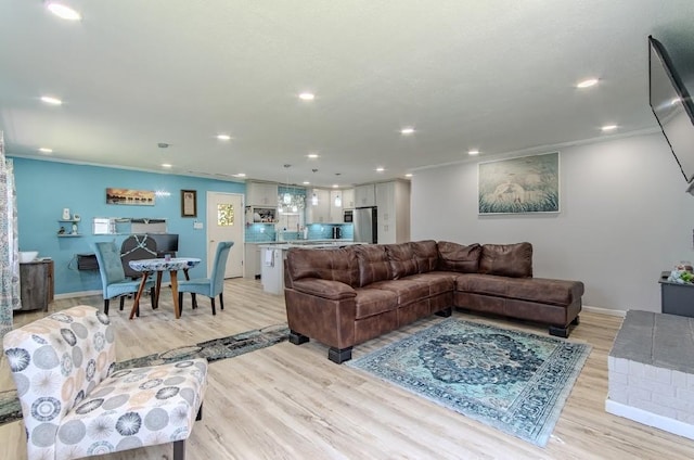 262 Purdy Rd, Selmer, TN 38375 - living room with light wood-style floors, recessed lighting, baseboards, and ornamental molding