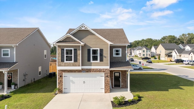 6787 Dharma Loop, Chattanooga, TN 37412 - view of front of property featuring stone siding, driveway, a garage, a front yard, and a residential view