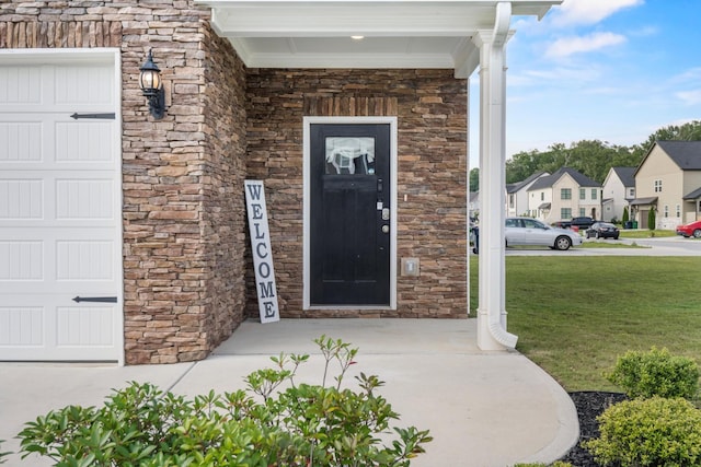 6787 Dharma Loop, Chattanooga, TN 37412 - doorway to property with stone siding, covered porch, and a residential view