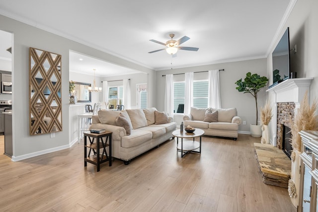 6787 Dharma Loop, Chattanooga, TN 37412 - living room featuring a ceiling fan, a glass covered fireplace, light wood-type flooring, a chandelier, and baseboards