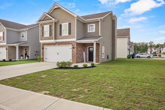6787 Dharma Loop, Chattanooga, TN 37412 - view of front of property with concrete driveway, a garage, a front yard, and stone siding