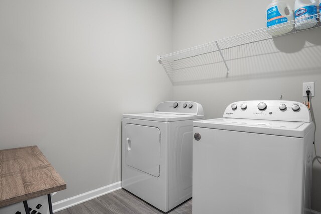6787 Dharma Loop, Chattanooga, TN 37412 - washroom with washer and dryer, wood finished floors, and baseboards