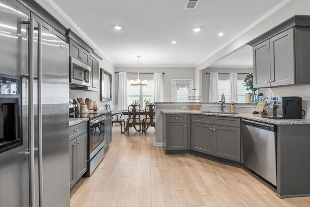 6787 Dharma Loop, Chattanooga, TN 37412 - kitchen featuring stainless steel appliances, a sink, crown molding, gray cabinets, and recessed lighting