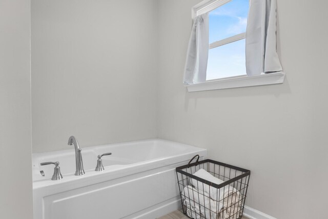 6787 Dharma Loop, Chattanooga, TN 37412 - full bathroom featuring a bath and baseboards