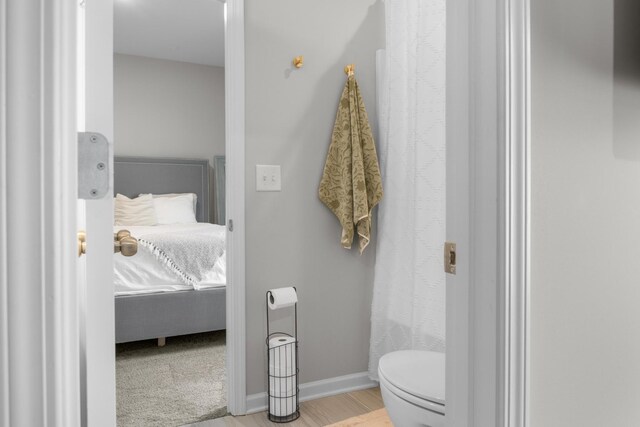 6787 Dharma Loop, Chattanooga, TN 37412 - full bathroom with toilet, wood finished floors, and baseboards