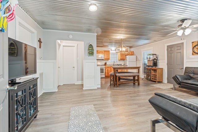 4053 Deer Creek Rd, Linden, TN 37096 - living area featuring ceiling fan, wainscoting, and light wood-style floors