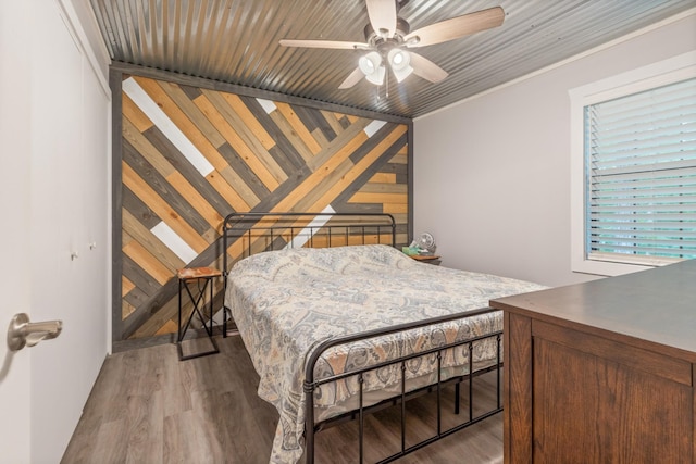 4053 Deer Creek Rd, Linden, TN 37096 - bedroom with wood finished floors, wood walls, and ceiling fan