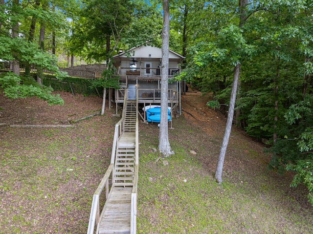 4053 Deer Creek Rd, Linden, TN 37096 - rear view of property with stairway, a wooden deck, and view of wooded area