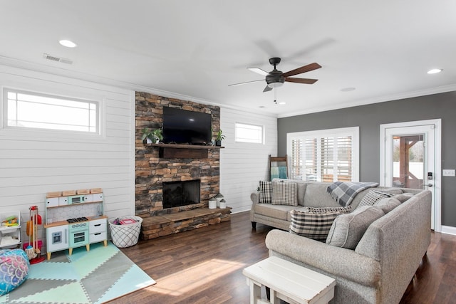 2466 Cason Ln, Murfreesboro, TN 37128 - living area with plenty of natural light, a ceiling fan, dark wood-style floors, crown molding, and a stone fireplace