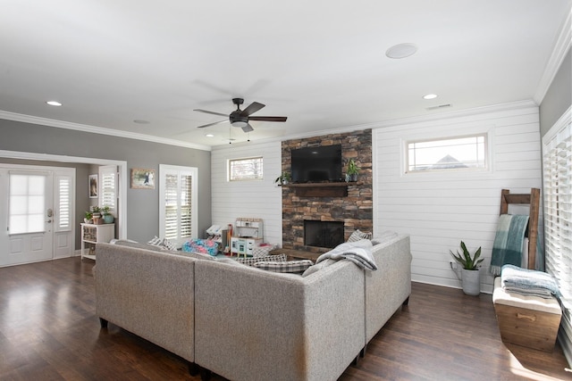2466 Cason Ln, Murfreesboro, TN 37128 - living area featuring crown molding, dark wood-type flooring, a ceiling fan, a stone fireplace, and healthy amount of natural light