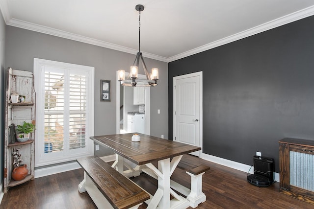2466 Cason Ln, Murfreesboro, TN 37128 - dining space with washer and clothes dryer, wood finished floors, a chandelier, crown molding, and baseboards