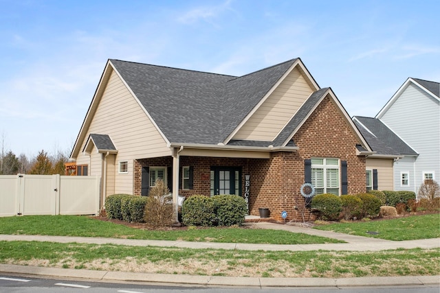 2466 Cason Ln, Murfreesboro, TN 37128 - view of front of property featuring a gate, brick siding, roof with shingles, and covered porch