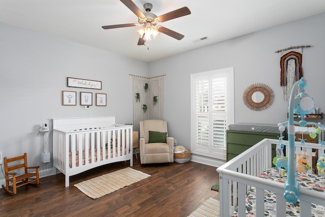 2466 Cason Ln, Murfreesboro, TN 37128 - bedroom with wood finished floors, baseboards, ceiling fan, and a nursery area