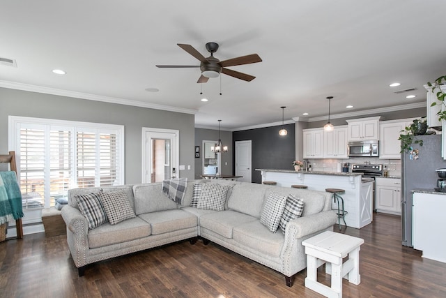 2466 Cason Ln, Murfreesboro, TN 37128 - living room with ceiling fan, dark wood-style flooring, crown molding, recessed lighting, and a chandelier