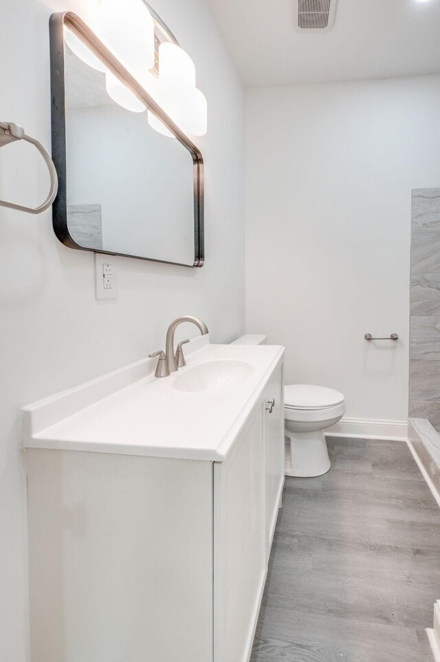 117 Apollo Ct W, Antioch, TN 37013 - bathroom with vanity, toilet, wood finished floors, and baseboards