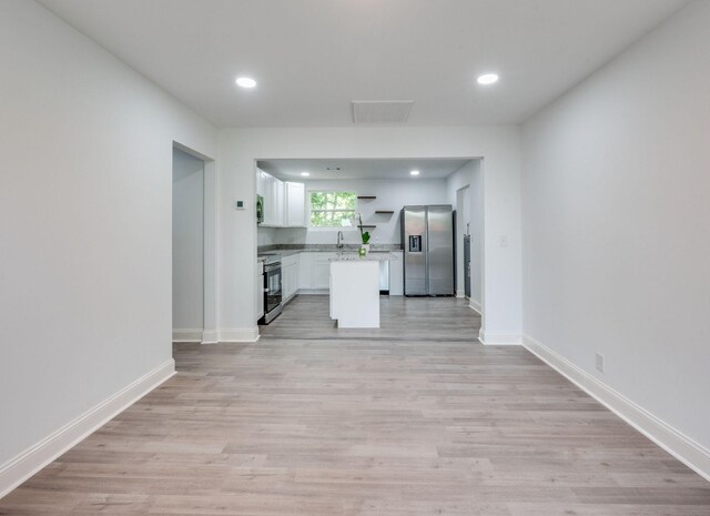 117 Apollo Ct W, Antioch, TN 37013 - kitchen with stainless steel appliances, white cabinets, light wood finished floors, recessed lighting, and a sink
