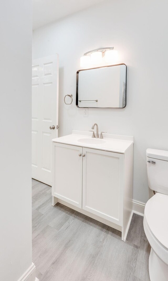 117 Apollo Ct W, Antioch, TN 37013 - bathroom featuring toilet, wood finished floors, vanity, and baseboards