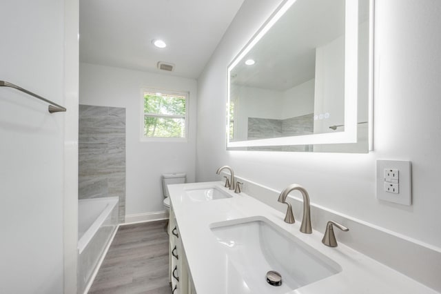 117 Apollo Ct W, Antioch, TN 37013 - bathroom with toilet, double vanity, wood finished floors, and recessed lighting