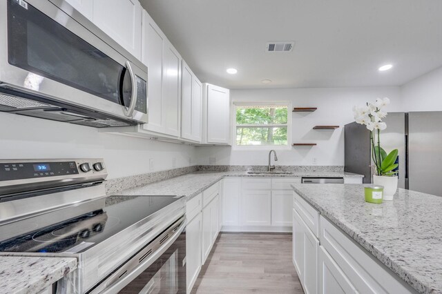 117 Apollo Ct W, Antioch, TN 37013 - kitchen with stainless steel appliances, a sink, white cabinets, and recessed lighting