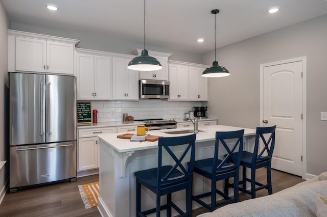 301 Evans Dr, Tullahoma, TN 37388 - kitchen with stainless steel appliances, tasteful backsplash, light countertops, white cabinets, and recessed lighting
