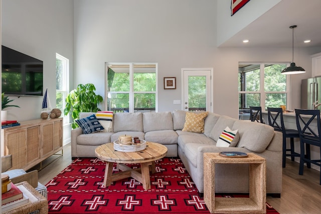 301 Evans Dr, Tullahoma, TN 37388 - living room featuring a high ceiling, healthy amount of natural light, wood finished floors, and recessed lighting