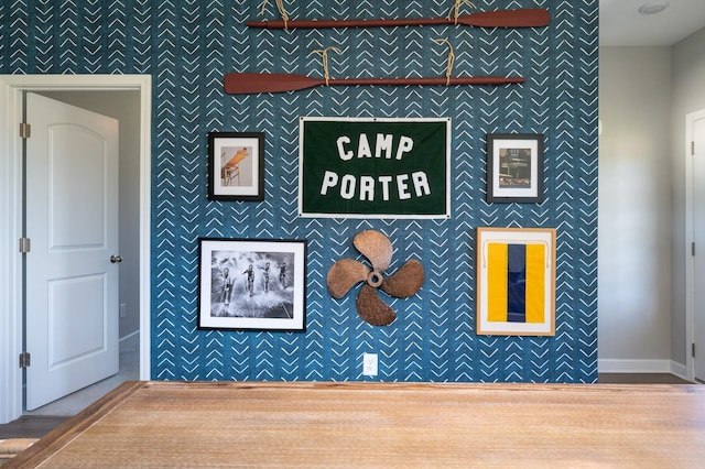 301 Evans Dr, Tullahoma, TN 37388 - detailed view of an accent wall, baseboards, wallpapered walls, and wood finished floors