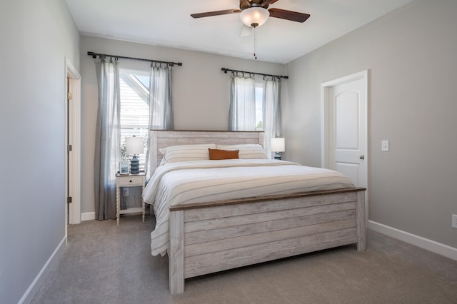 301 Evans Dr, Tullahoma, TN 37388 - bedroom featuring multiple windows, carpet flooring, baseboards, and a ceiling fan