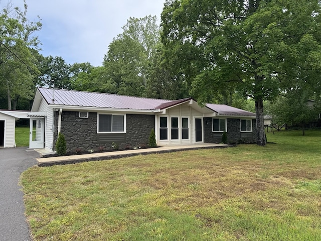 2306 Raspberry Ln, Lebanon, TN 37087 - view of front of property featuring stone siding, a front yard, metal roof, and driveway