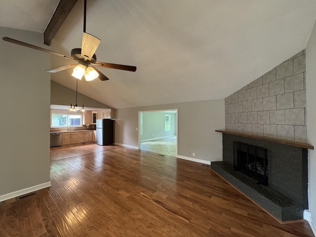 2306 Raspberry Ln, Lebanon, TN 37087 - unfurnished living room with a sink, a fireplace, wood finished floors, ceiling fan, and baseboards