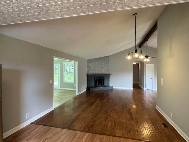 2306 Raspberry Ln, Lebanon, TN 37087 - unfurnished living room featuring wood finished floors, baseboards, a large fireplace, and ceiling fan