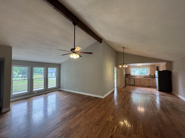 2306 Raspberry Ln, Lebanon, TN 37087 - unfurnished living room featuring a textured ceiling, dark wood-style flooring, ceiling fan, baseboards, and a chandelier