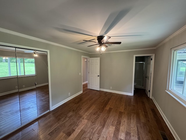 2306 Raspberry Ln, Lebanon, TN 37087 - unfurnished bedroom featuring dark wood finished floors, baseboards, crown molding, ceiling fan, and a closet