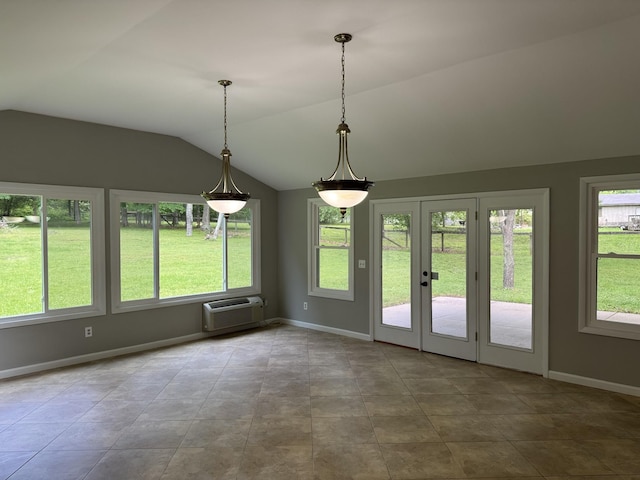 2306 Raspberry Ln, Lebanon, TN 37087 - unfurnished dining area featuring a wall mounted AC, vaulted ceiling, baseboards, and french doors