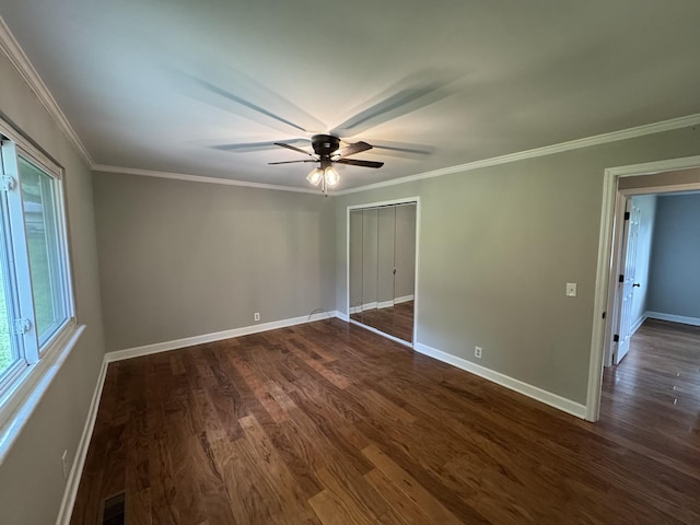 2306 Raspberry Ln, Lebanon, TN 37087 - spare room with dark wood-style floors, ceiling fan, baseboards, and crown molding