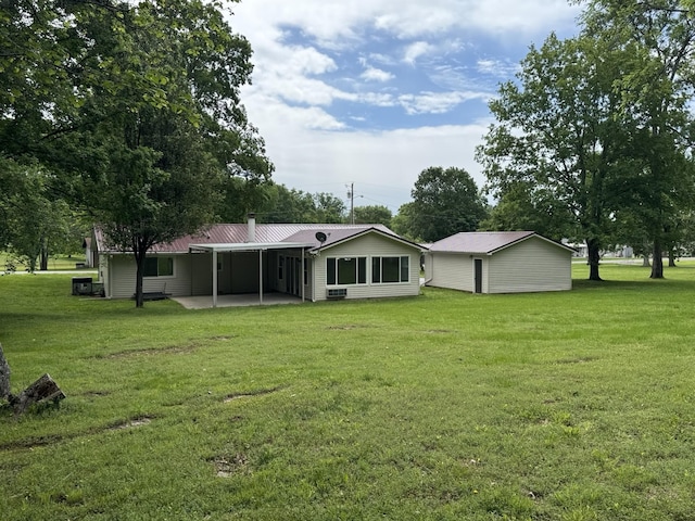 2306 Raspberry Ln, Lebanon, TN 37087 - rear view of property with a lawn, metal roof, a patio, and an attached carport