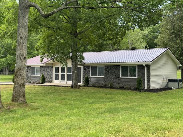 2306 Raspberry Ln, Lebanon, TN 37087 - ranch-style house featuring stone siding, a front lawn, and metal roof
