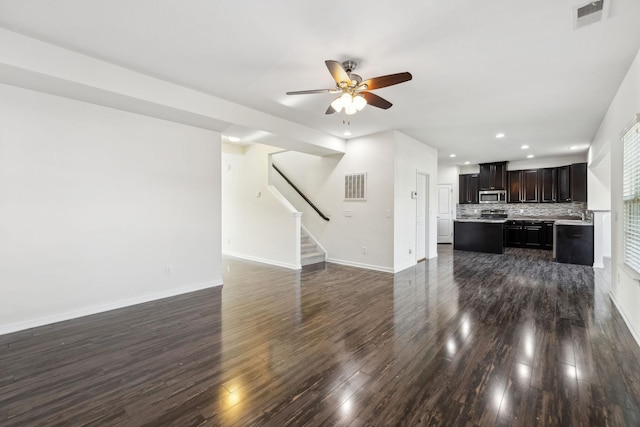 2003 Allerton Way, Spring Hill, TN 37174 - unfurnished living room with dark wood-type flooring, recessed lighting, a ceiling fan, stairway, and baseboards
