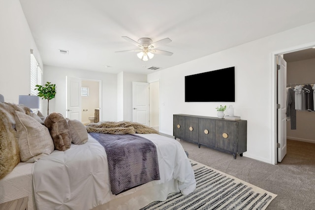 2003 Allerton Way, Spring Hill, TN 37174 - bedroom featuring light colored carpet, baseboards, ceiling fan, connected bathroom, and a spacious closet