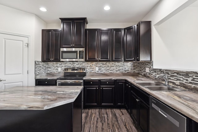 2003 Allerton Way, Spring Hill, TN 37174 - kitchen featuring appliances with stainless steel finishes, a sink, dark wood finished floors, backsplash, and recessed lighting