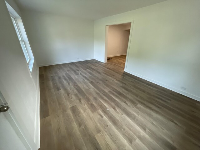 119 Maple Ave, Camden, TN 38320 - spare room with dark wood-type flooring and baseboards
