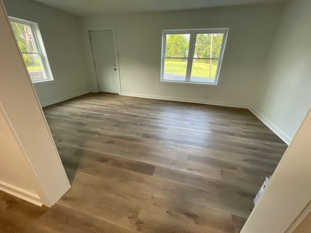 119 Maple Ave, Camden, TN 38320 - unfurnished room with baseboards and wood finished floors